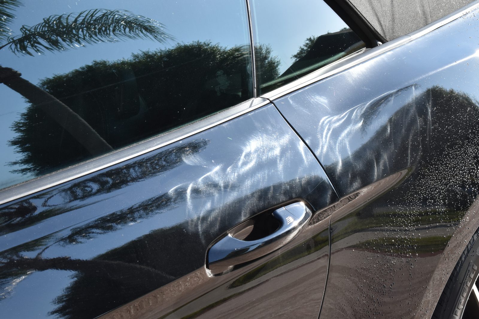 2018 Ford Mustang GT door before paint correction, showing buffer trails and holograms